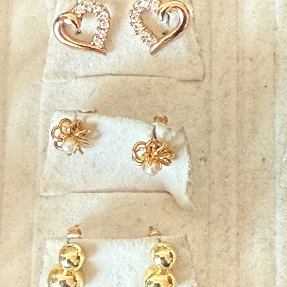 9 Pairs Gold Plated Earrings in elegant red travel box.